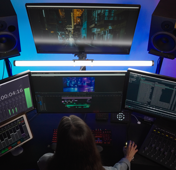 a human mixing sound effects with multiple displays